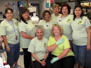 Staff wear Be Green T-Shirts during Earth Day